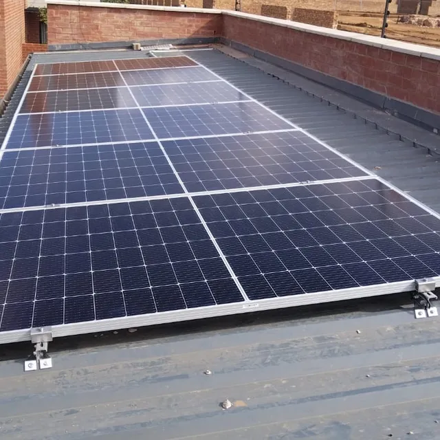 AJM Solar technician installing a rooftop solar panel array